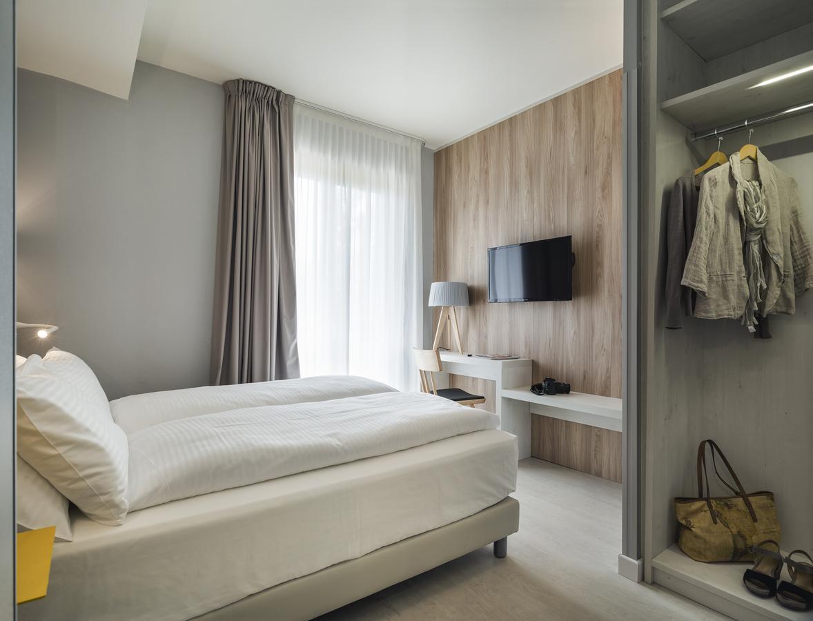 Hatelier Garda Home By Enjoy Garda Hotel เปสเคียรา เดล การ์ดา ภายนอก รูปภาพ